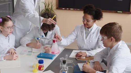 Kids Doing Science Experiment in School Classroom