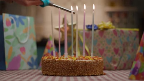 Lighting Candles on a Festive Birthday Cake