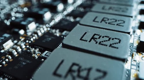 Macro Camera Moving Slowly over Printed Circuit Board, showing Computer Motherboard Components: Mic