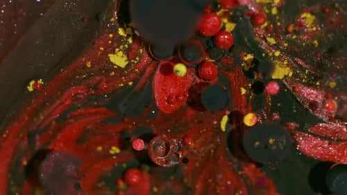 Fluid Art: Black, Red, Yellow Bubbles in Motion