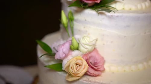 Close-up Of Wedding cake decorated with colorful roses, Tilt up shot