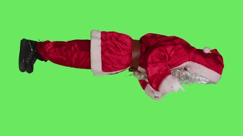 Santa Claus Lying on Green Screen Pointing