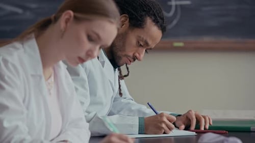 Medical Students Studying and Writing Notes Together