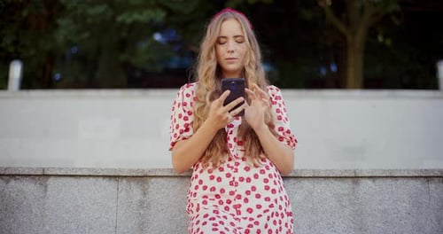 Woman Text Messaging on Mobile Phone