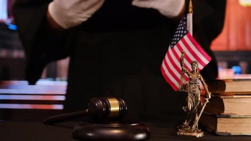 A Detailed Courtroom Scene Depicting a Gavel a Statue of Lady Justice
