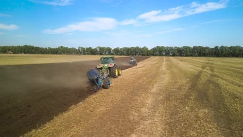 Tractors plowing the field in Ukraine