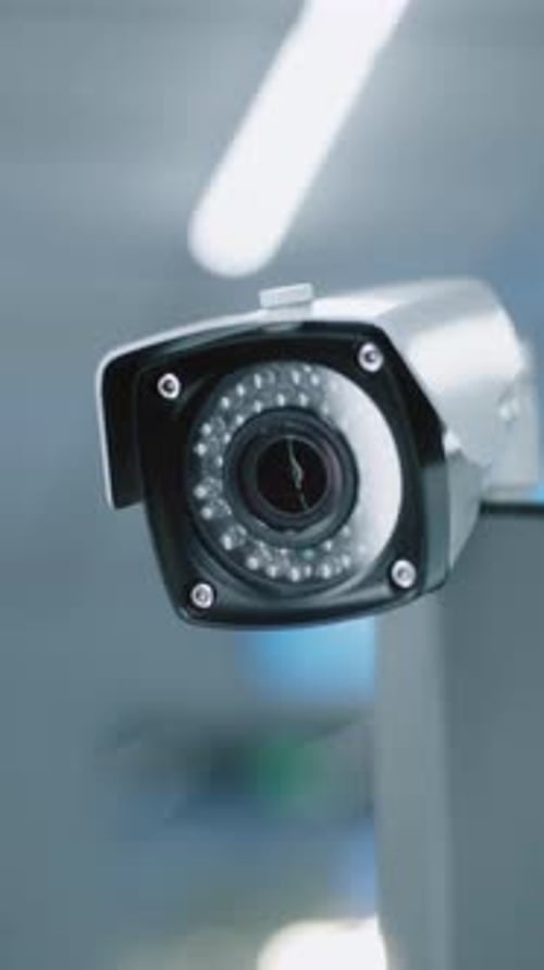 Close Up of Installed CCTV Camera Professional Video Surveillance System in Modern Airport Terminal
