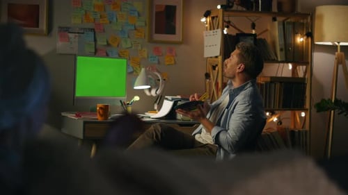 Relaxed Person Speaking Green Screen Computer at Home