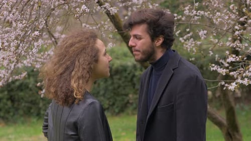 woman giving slap to his boyfriend during quarrel in the park.Aggression,violence