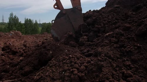 Powerful Digger Truck Takes Dirt Pile at Open Construction