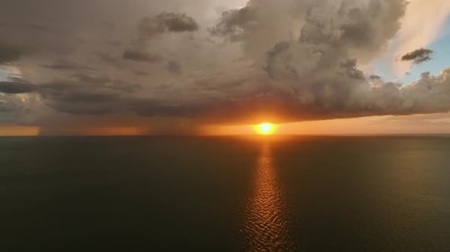 Dark Weather Front Clouds Forming on Stormy Sky During Heavy Rainfall Season Over Sea Water in