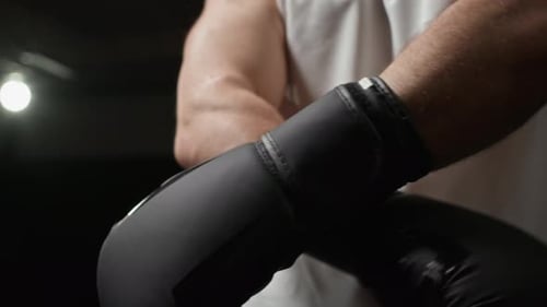 Boxer Bumping Black Boxing Gloves Together