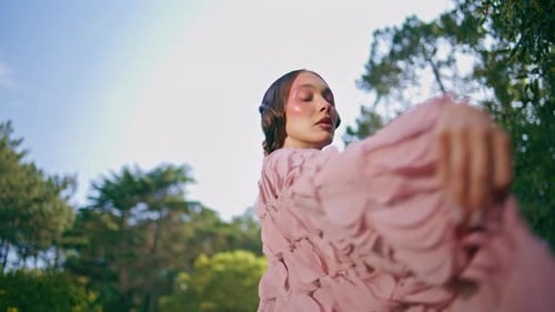 Sensual Model Posing Woods Landscape Moving Hands with Airy Dress Close Up