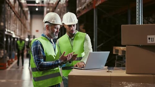 Diverse Employees Working at a Vast Logistics Center for an International Online Shopping Platform