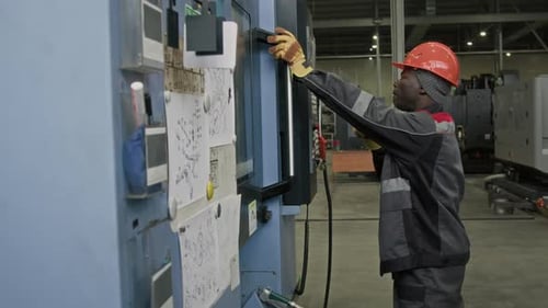 Factory Engineer Monitoring Production Process