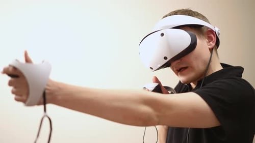 Young Adult Immersed in Virtual Reality Gaming