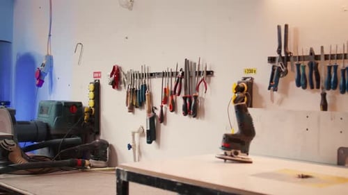 Close Up of Electric Router with Woodworking Tools on Rack