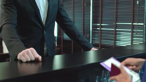 Close up hands of passenger give passport and boarding pass to air hostess or staff