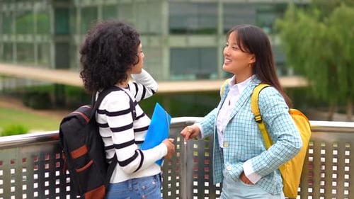 Smiling Multiracial Woman Talking in the University Campus