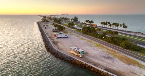 Florida Campground with Motorhomes and View of Sunshine Skyway Bridge at Dusk