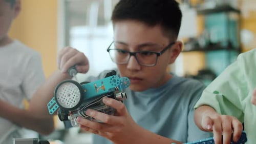 Students Building Robots in School Science Class