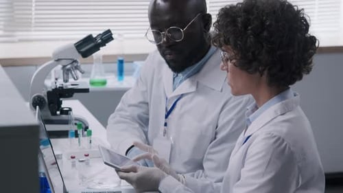 Scientists Working on Tablet in Research Lab