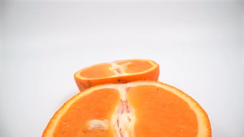 Cut orange macro on white background isolated 4K