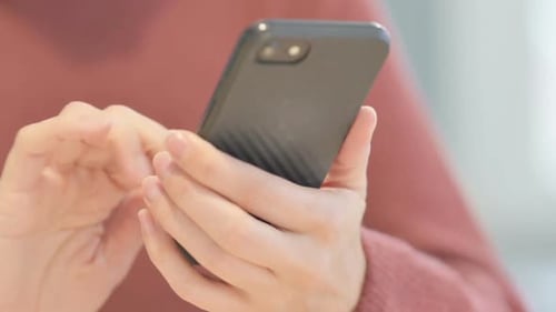 Close up of Female Hand Using Smartphone