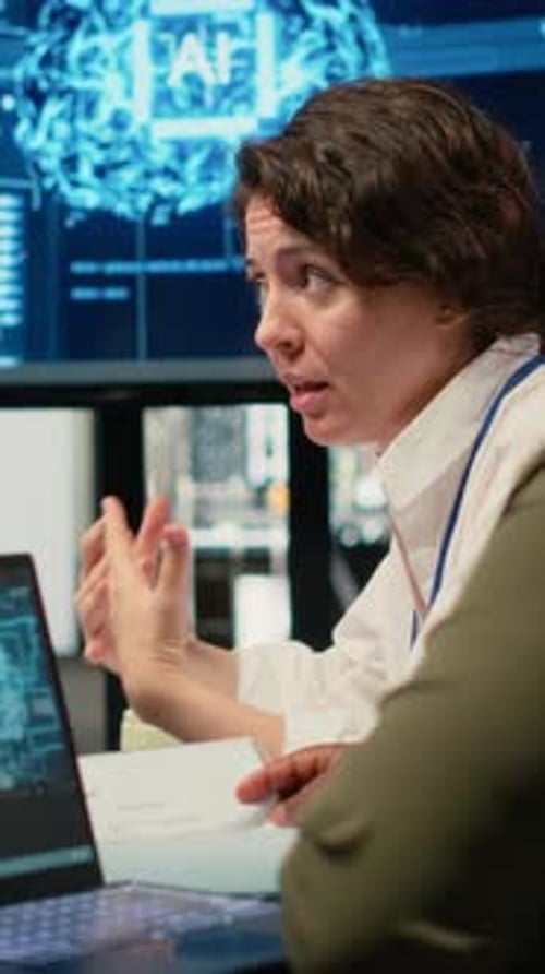 Vertical Video System Administrators in Startup Office Brainstorming Leverage AI Tech