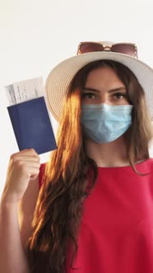 Woman with Passport and Face Mask Ready to Travel