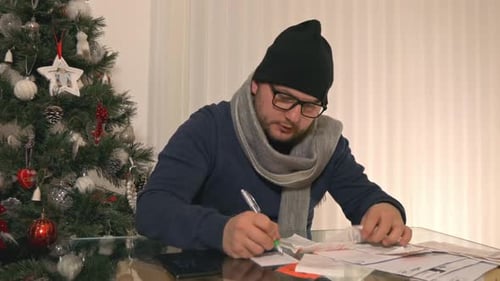Man Stressed About Finances During Christmas Time