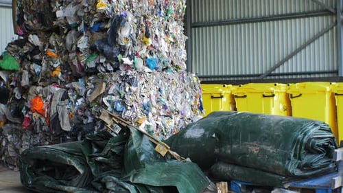 Stack of different types of large garbage dump, plastic bags, and landfill full of trash, environmen