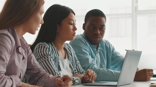 Students Collaborate on Projects in a Bright University Study Space