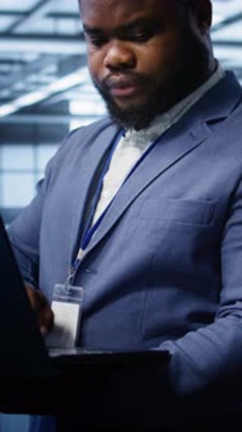 Vertical Video Software Developer in Data Center Runs System Diagnostic Tests on Notebook