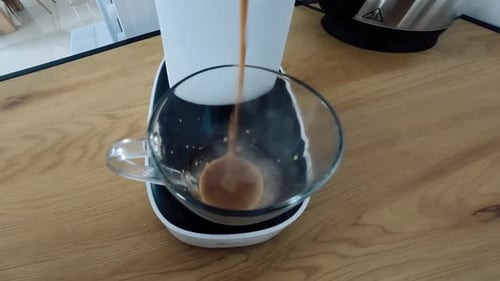 Close-up of Coffee Machine Making Coffee with Milk into the Glass
