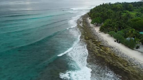 Maldives Island with Beach and Ocean with Waves Aerial View