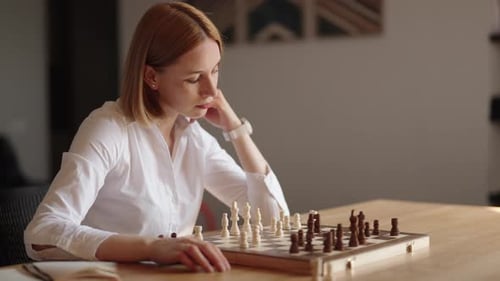 Business Woman Playing Chess