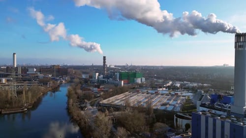 Waste energy plant factory with smoke chimney. Spectacular aerial view flight drone