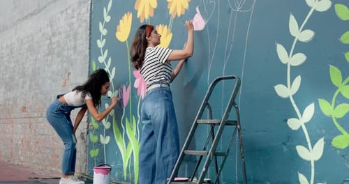 People, students and painting mural on wall of creative decoration, community project