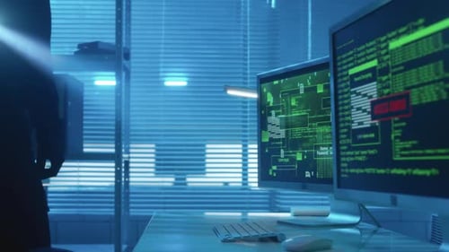 Hacker is Typing on a Computer Keyboard Cracking a Password and Launches a Virus Attack