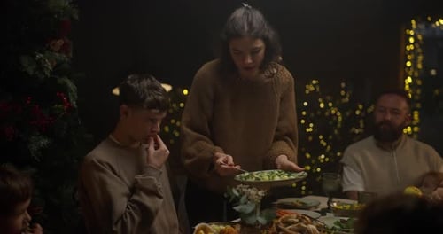 Family Holiday Gathering at Warm Christmas Dinner Table