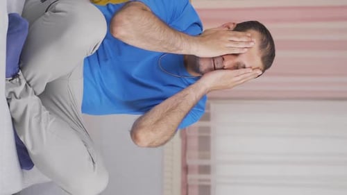 Vertical video of Frustrated man gets angry.