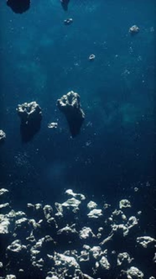 Floating Asteroids in Dark Blue Space Motion Background
