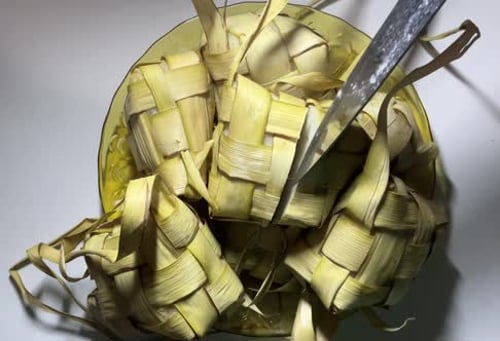 Cutting Ketupat on Glass Plate