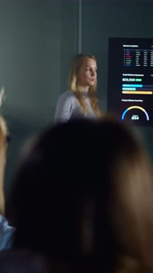 Woman Leads a Business Presentation in an Office