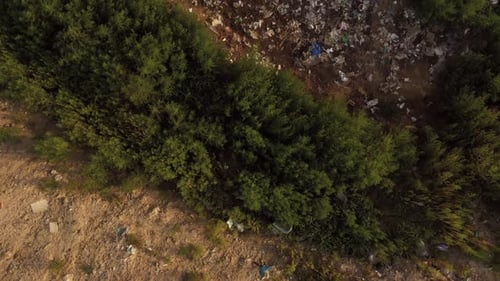 Top View of a Large Pile of Garbage in a Countryside Field