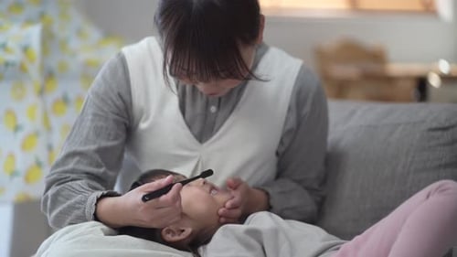 Child Having Their Teeth Brushed at Home