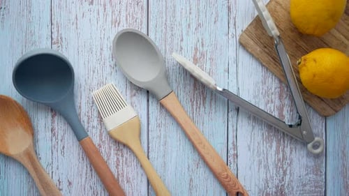 Wooden Cutlery Fork and Spoon on a Chopping Board on Table