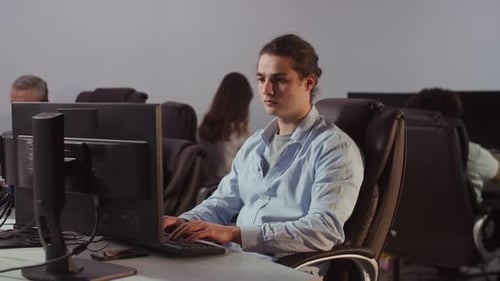 A Young Man Working in the Office at the Computer Received a Happy Letter By Email Office Workers