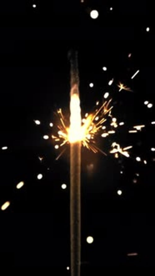 A Bengal Candle Burns Brightly Against a Black backgroundFilmed is Slow Motion 1000 Frames Per
